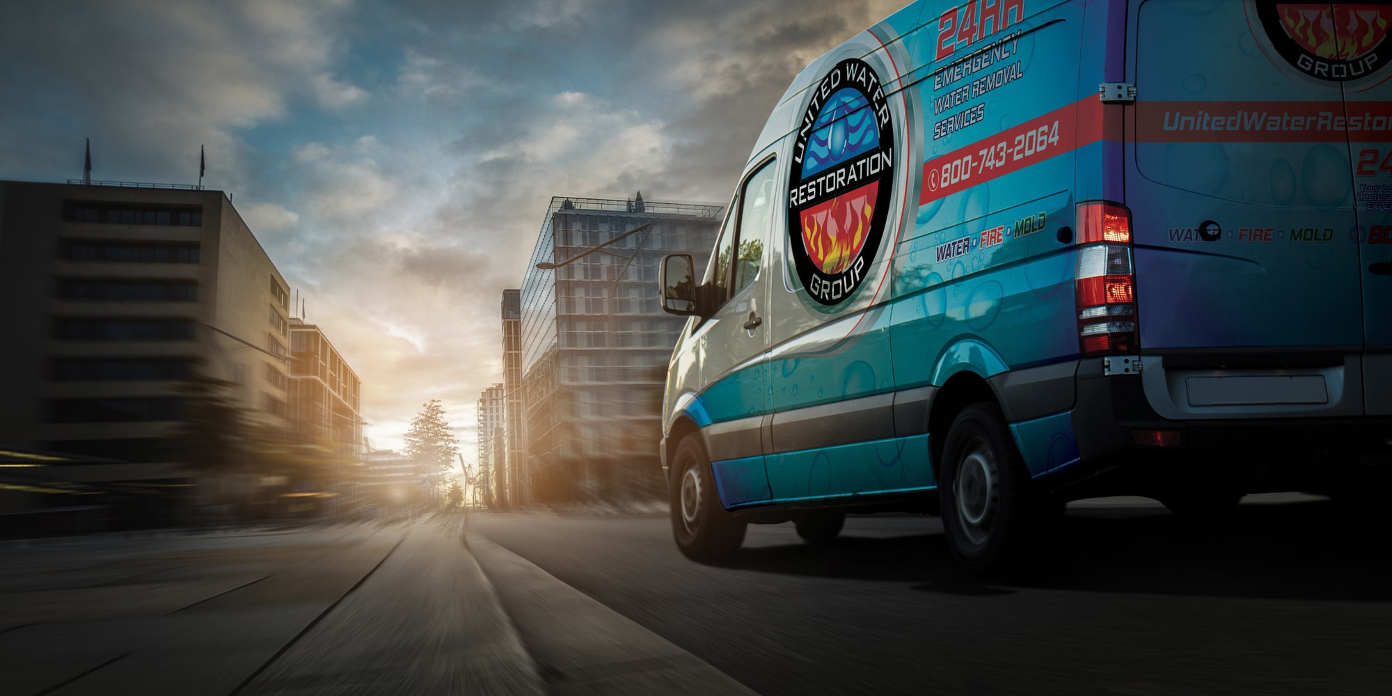 A United Water Restoration Group of Austin van heading out on an emergency call at sunset